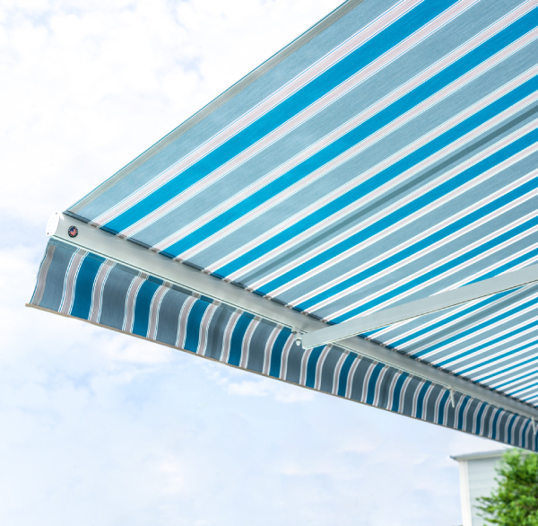 Continuously-Improving-Processes Underside of a straight awning with blue, white, and grey fabric panels