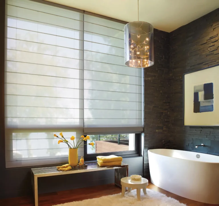 Ceiling to floor Hunter Douglas Motorized Alustra Woven Textures Roman Shade provides privacy in bathroom