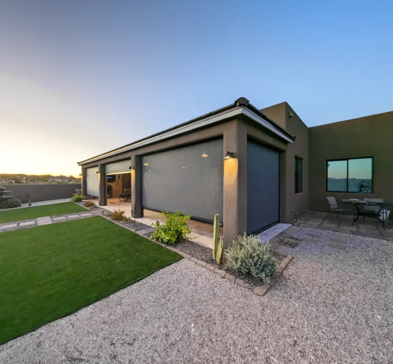 MagnaTrack Patio completely enclosing patio to protect from sun and wind in stucco home