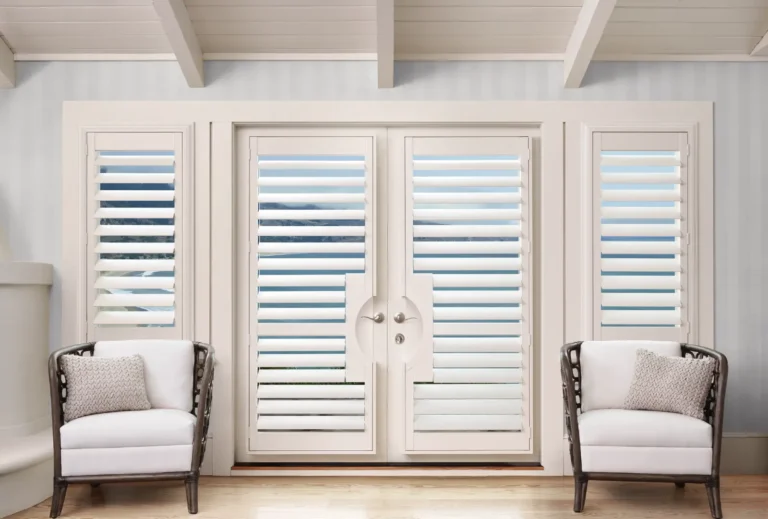 Hunter Douglas palm beach vinyl white cut out shutters over a french door with covered side windows