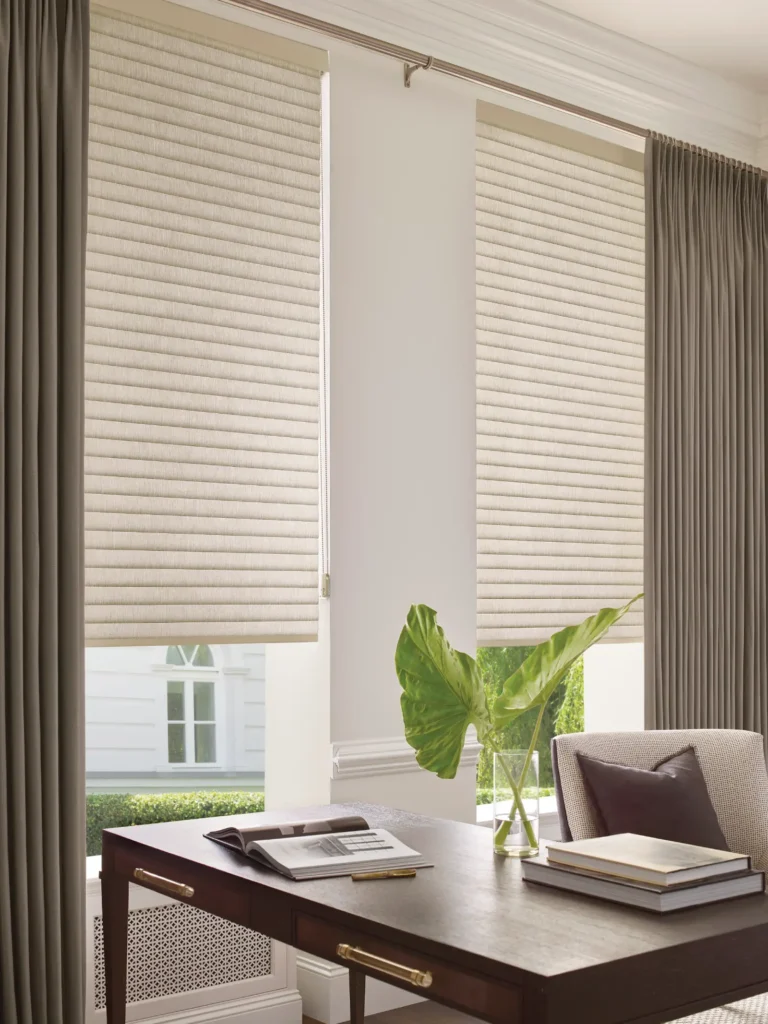 Hunter Douglas Sonnette energy efficient cellular shades with corded loop manual operating system dressed with custom Carole Fabrics drapery