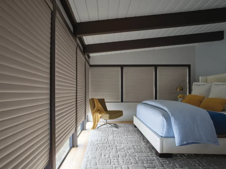 Hunter Douglas Sonnette cellular energy efficient motorized shades in bedroom in room darkening providing dark sleeping conditions