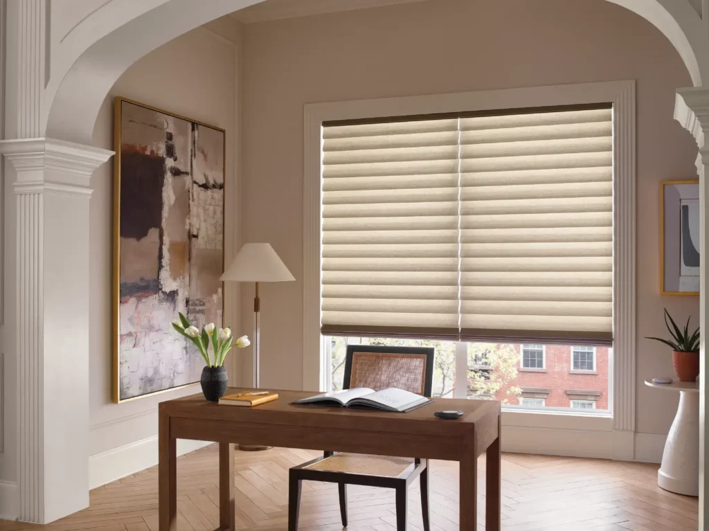 Light filtering Hunter Douglas motorized Vignettes roman shades in an office